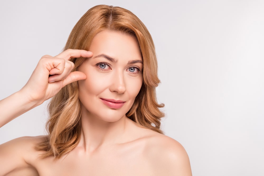 Woman with smooth skin after getting Botox or Dysport injectable treatment. Woman with smooth skin after getting Botox or Dysport injectable treatment.